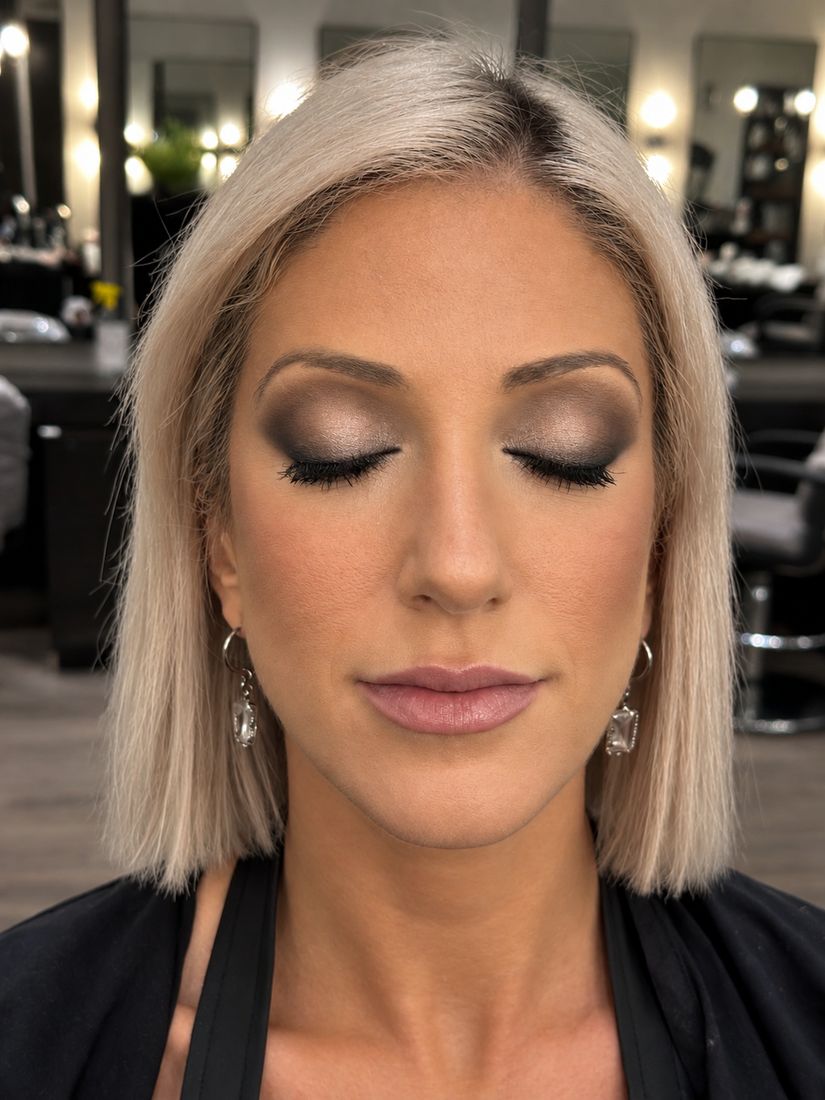 Soft bridal smoky eye with lashes and a mauve lip, eyes closed